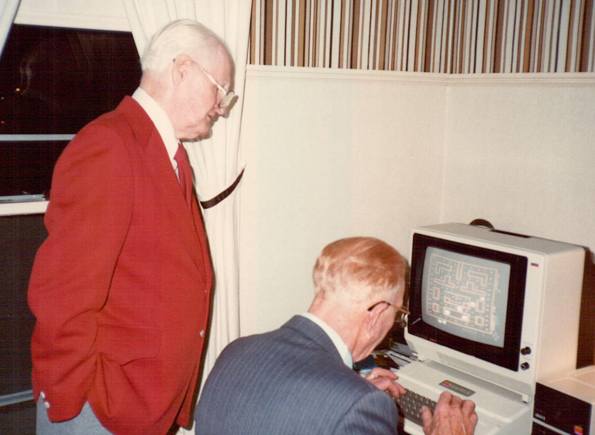 “Grandpa trying out Pac-Man while my other grandpa looks on, 1982.”